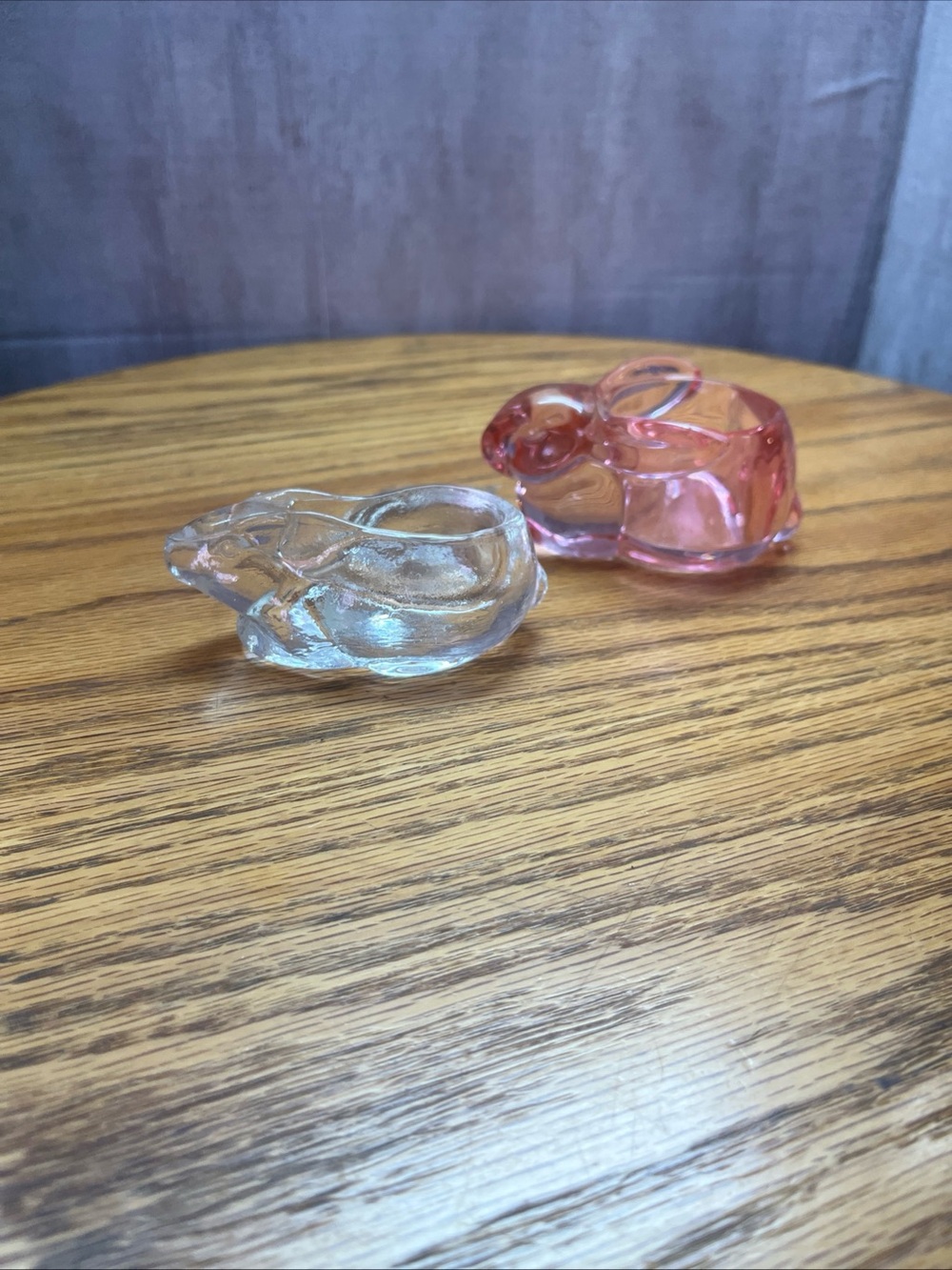 Two small glass bunnies candle holders